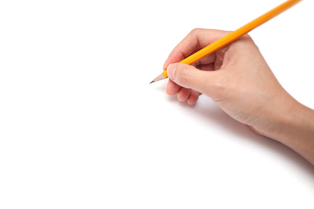 A hand is holding a pencil ready to draw, isolated on white background.