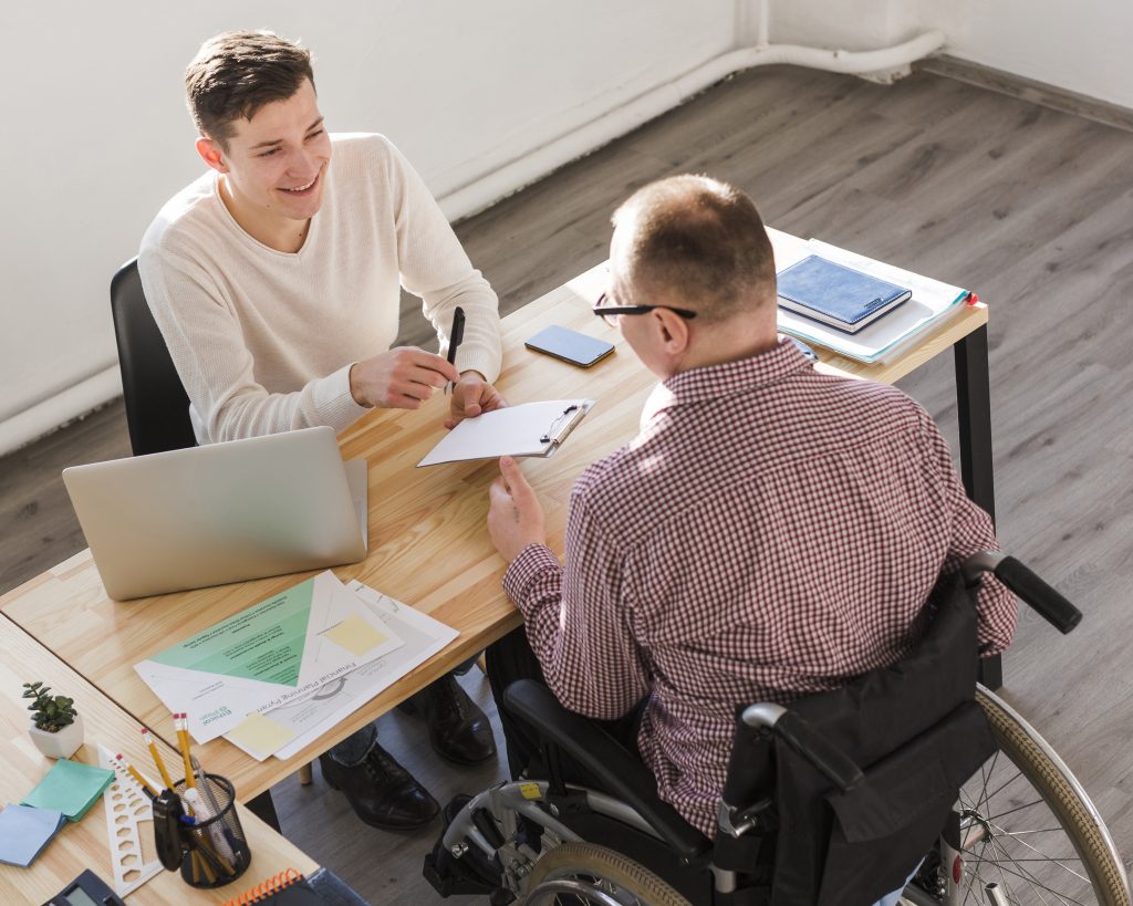 disabled-worker-filling-papers-for-contract-1-1024x819-1